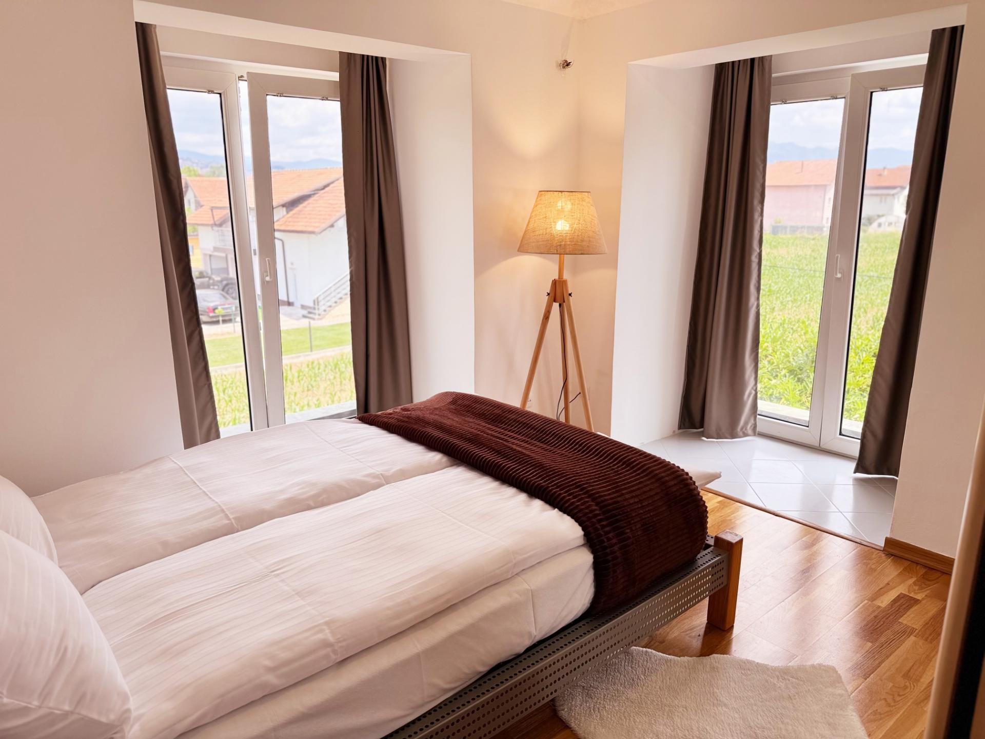 Bedroom with large windows